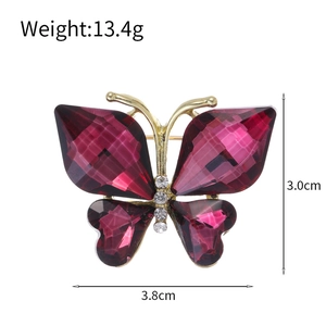 Broche papillon élégante en cristal violet foncé avec détails dorés et strass brillants