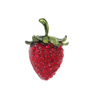 Fashion strawberry brooch with red crystals and green enamel details on white background