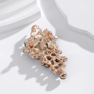 Luxurious crystal grape brooch with rose gold metal base and tassel detail seen from behind