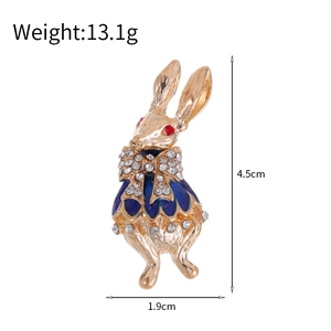 Vintage gold rabbit brooch with blue dress and red rhinestone eyes, 4.5cm height