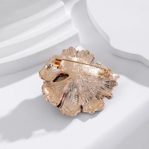 Peony flower brooch back detail with rose gold plating and secure pin clasp on white base