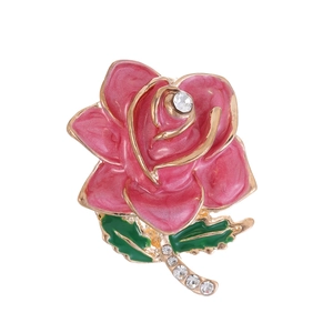 Pink enamel rose flower brooch with gold plating and crystal accents on white background