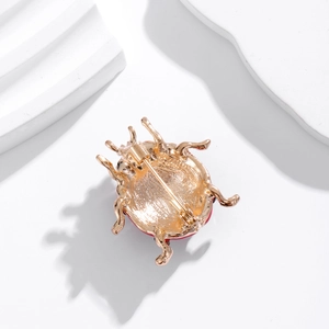 Golden ladybug brooch with detailed alloy craft and secure pin clasp on the back