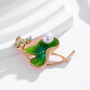 Elegant lotus brooch with green enamel leaf, white pearl and golden metal finish