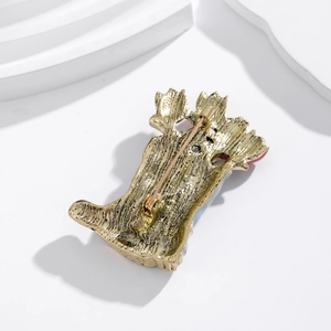 Vintage style boot brooch in antique gold finish showing the pin clasp on the back