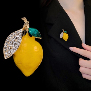 Fresh lemon brooch with yellow enamel, green gemstone leaf and sparkling white rhinestones