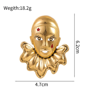 Vintage gold clown mask brooch with red star and tear details, size 6.2cm x 4.7cm