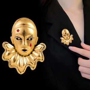 Vintage gold clown mask brooch with red star and tear drop detail for suit jackets