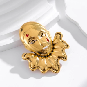 Vintage clown mask brooch in gold plating with red star accents for suits and sweaters