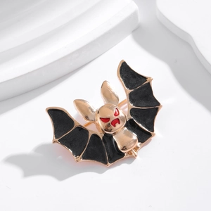 Creative gold bat brooch with black enamel inlay and red eyes for suit lapel accessories