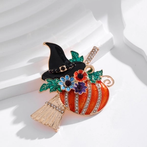 Halloween witch hat and pumpkin brooch with rhinestones on golden flying broom