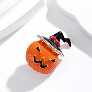 Halloween pumpkin brooch with orange enamel finish and rhinestone witch hat design