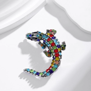 Detailed view of crocodile brooch with colorful rhinestones and intricate alloy texture
