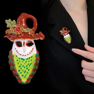 Enamel owl brooch with witch hat and scarf, halloween jewelry shown on black suit jacket