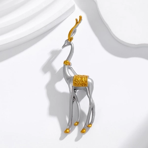 Elegant gold and silver elk brooch in a minimalist luxury design on white stone