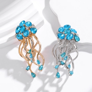 Elegante Quallen-Brosche mit blauen Kristallen und Strasssteinen in Gold- und Silberoptik