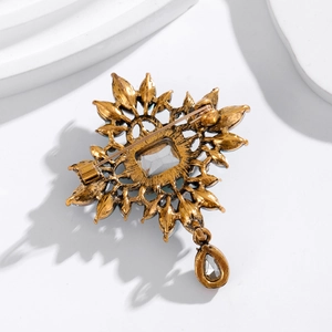 Vintage crystal pendant brooch with baroque metal frame and teardrop stone back view