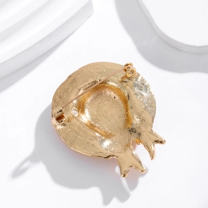 Golden straw hat brooch with pearl flower and fruit pattern back view on white background