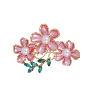 Elegant gold flower brooch with three pink enamel blossoms and white pearl centers