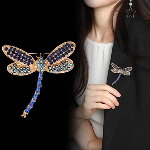Elegant vintage dragonfly brooch featuring deep blue crystals and rhinestones for women