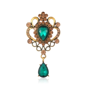Broche vintage baroque avec cristal vert en poire et strass couleur champagne