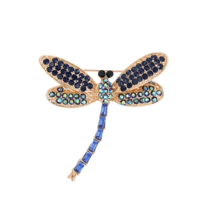 Vintage dragonfly brooch with blue crystals and colorful rhinestones on golden metal