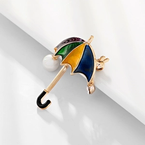 Enamel umbrella brooch with colorful drip oil and pearl accent on white background