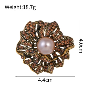 Vintage rose brooch with amber rhinestones and a purple pearl, size 4.4cm by 4.0cm