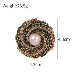Vintage bronze round brooch with pearl and champagne rhinestones, 4.3cm diameter