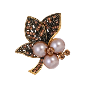 Vintage leaf brooch with amber rhinestones and purple pearls in gold plating