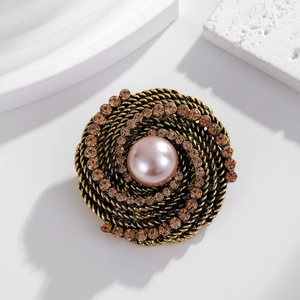 Vintage baroque brooch with center pink pearl and amber rhinestones in antique gold finish