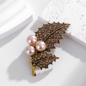 Elegant holly leaf brooch with pink pearls and rhinestones in vintage gold finish