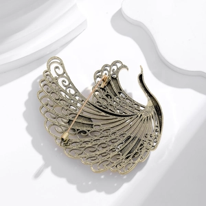 Vintage peacock phoenix brooch in antique cyan finish with intricate hollow metal wings