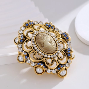Baroque cameo brooch with rhinestones and pearls on a vintage gold alloy base