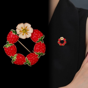 Cute strawberry wreath brooch with red enamel and white flower on black blazer