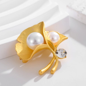 Elegant gold ginkgo leaf brooch with white pearls and sparkling crystal for suits
