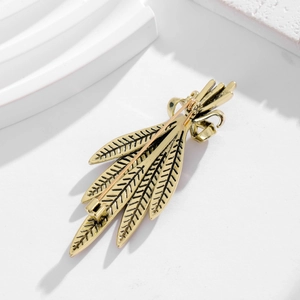 Detailed back view of vintage gold leaf brooch with secure pin clasp and textured finish