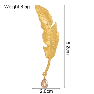 Elegant gold feather brooch with champagne teardrop gemstone, dimensions 8.2cm by 2.0cm