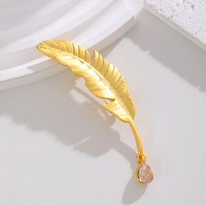 Elegant gold feather brooch with a light brown drop crystal pendant for suit blazers