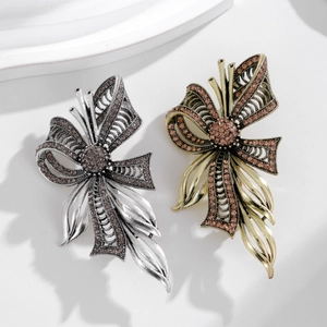 Vintage butterfly brooch pins with glittering rhinestones in gold and silver plating