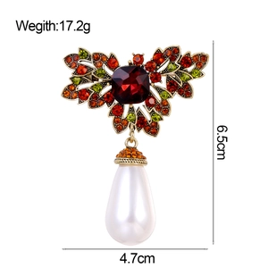 Vintage gold butterfly brooch with colorful crystals and hanging white pearl drop