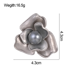 Elegant silver camellia flower brooch with grey pearl center and brushed texture