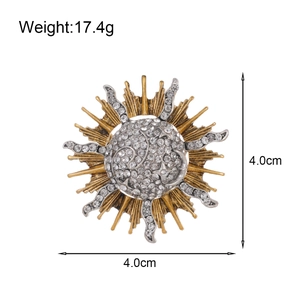 Vintage sunburst brooch with rhinestones in gold and silver finish, 4.0cm diameter