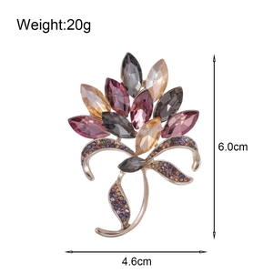 Luxurious flower brooch with purple and amber crystals and dimensions 6.0cm by 4.6cm