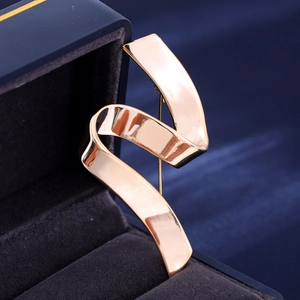 Polished gold ribbon brooch in minimalist style for suits and elegant coats