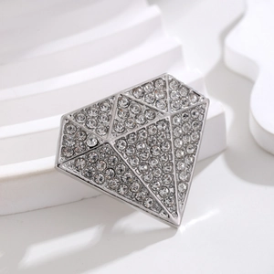 Sparkling geometric diamond-shaped brooch with clear rhinestones on silver alloy base