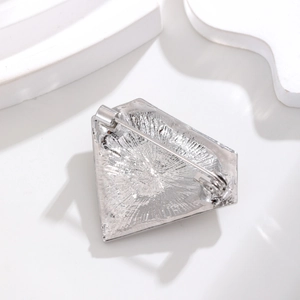 Vintage silver alloy rhinestone brooch with shield shape and textured back view