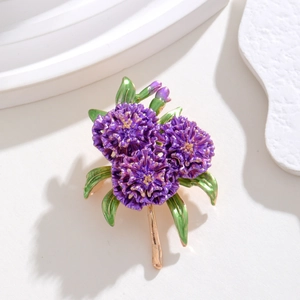 Detailed view of elegant purple hydrangea brooch with enamel petals and gold stems