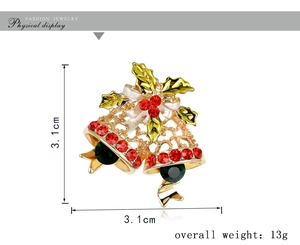 Detail of Christmas bell brooch with red and green rhinestones and size markings
