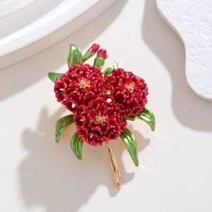 Elegant red hydrangea brooch with enamel petals and gold stems on minimalist background